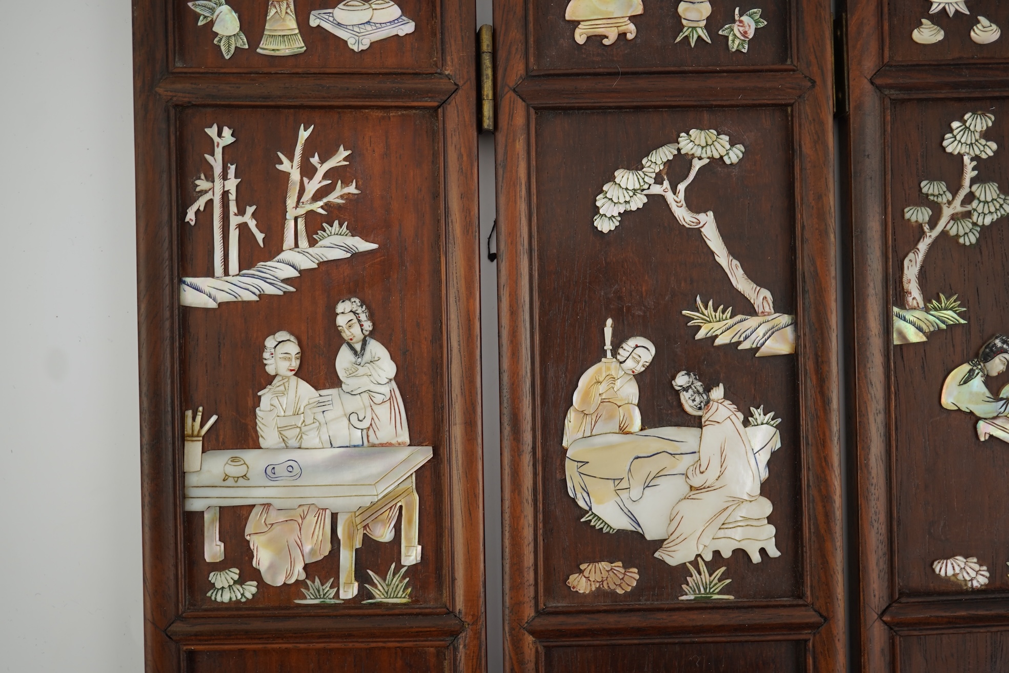 A Chinese mother-of-pearl overlaid hardwood miniature table screen, 19th century